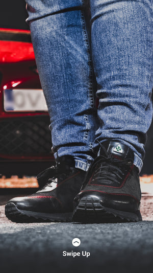 "JUST" BLACK SOLE SHOES AND RED STITCHING
